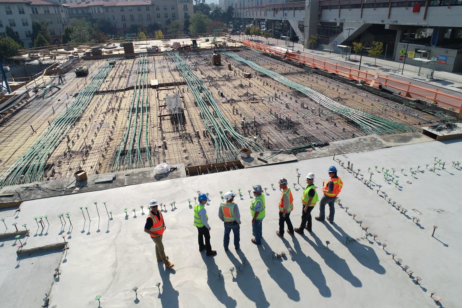 UWGM site team reviewing a steel structure project